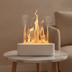 White flame-effect aroma diffuser with a warm wispy flame-and-mist glow on a marble side table
