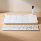 The whiteboard beside a full-size keyboard on the same desk, showing how wide it is