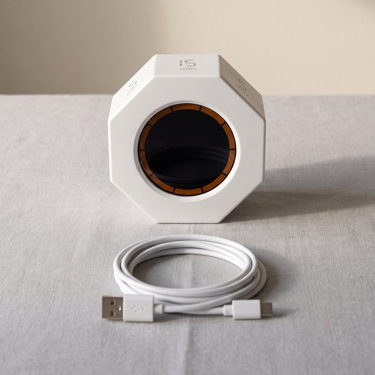 What comes in the box: the timer with its display switched off and a coiled white USB-A to USB-C cable