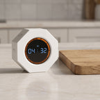 The timer on a stone kitchen counter next to a wooden chopping board, counting down 04:32
