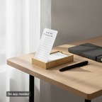 Bamboo to-do card holder on a desk corner beside a notebook and pen, with no phone or laptop in sight